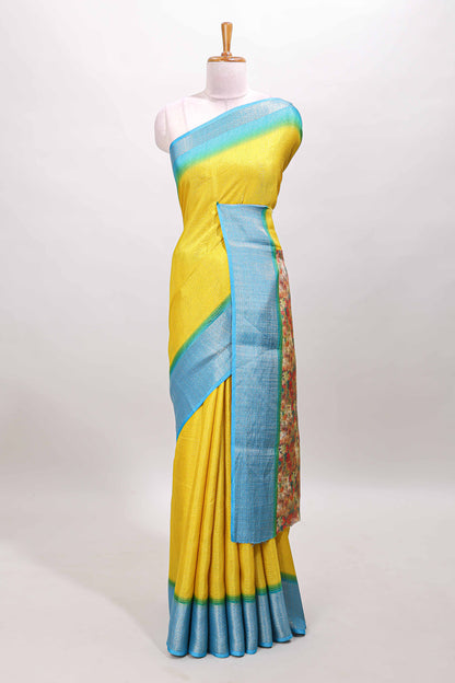 Yellow plain viscose dola silk saree with contrast zari border and floral design pallu