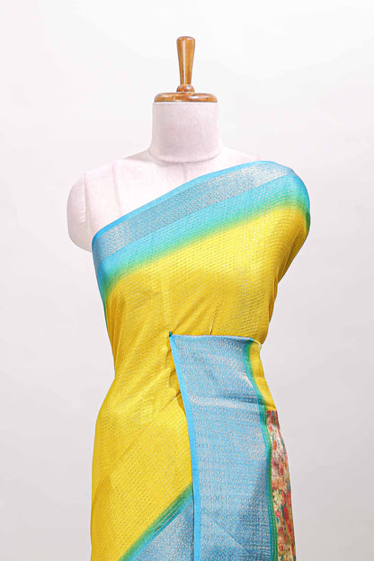 Yellow plain viscose dola silk saree with contrast zari border and floral design pallu