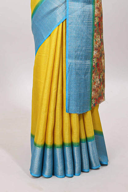 Yellow plain viscose dola silk saree with contrast zari border and floral design pallu