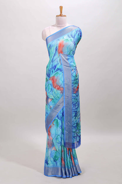 Aqua blue marsh georgette saree with artistic floral digital prints, self zari border and pallu, paired with a matching  blouse