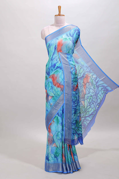 Aqua blue marsh georgette saree with artistic floral digital prints, self zari border and pallu, paired with a matching  blouse