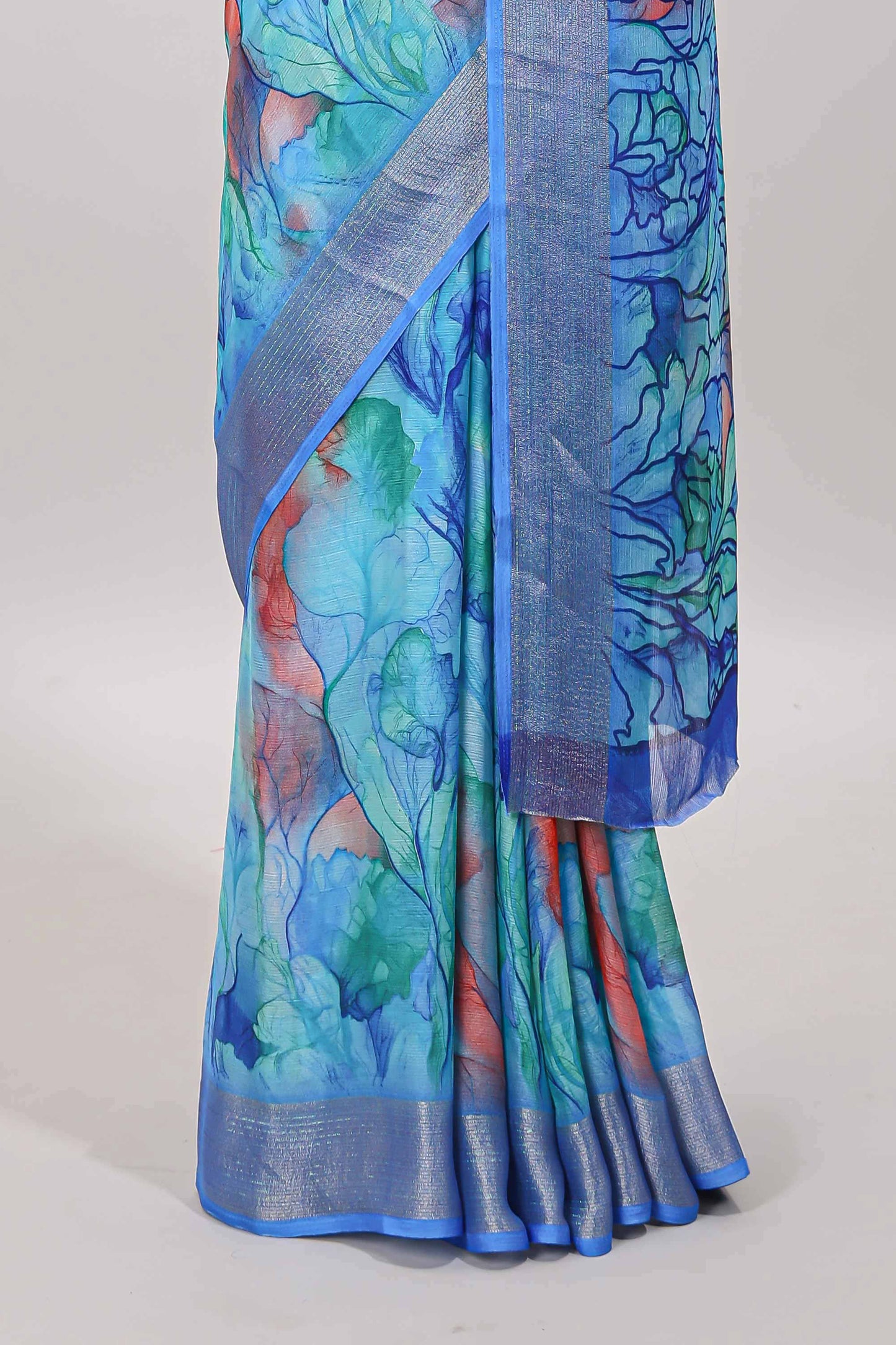 Aqua blue marsh georgette saree with artistic floral digital prints, self zari border and pallu, paired with a matching  blouse