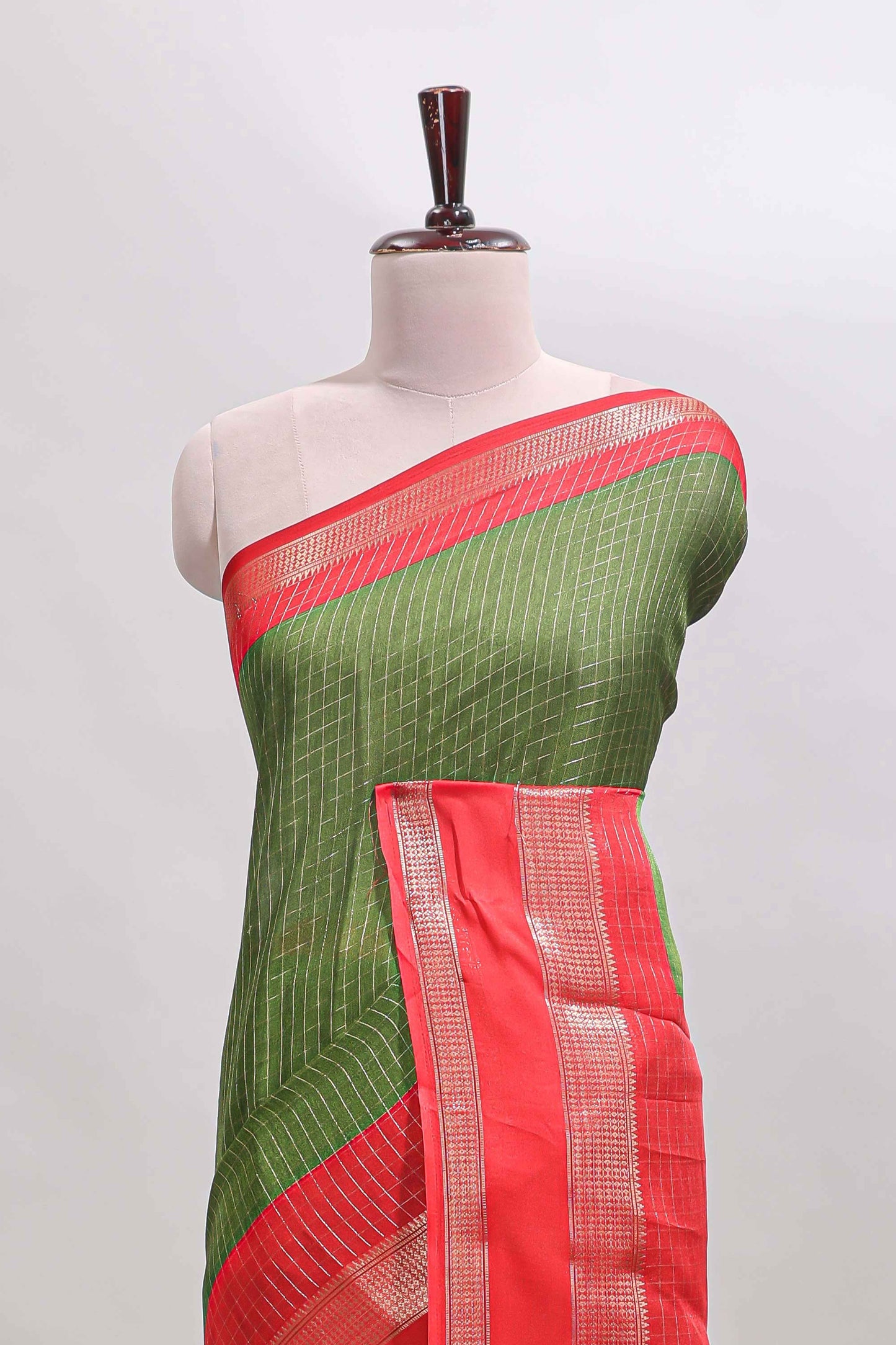 Green checked dola silk saree with contrast zari bentex border and blouse