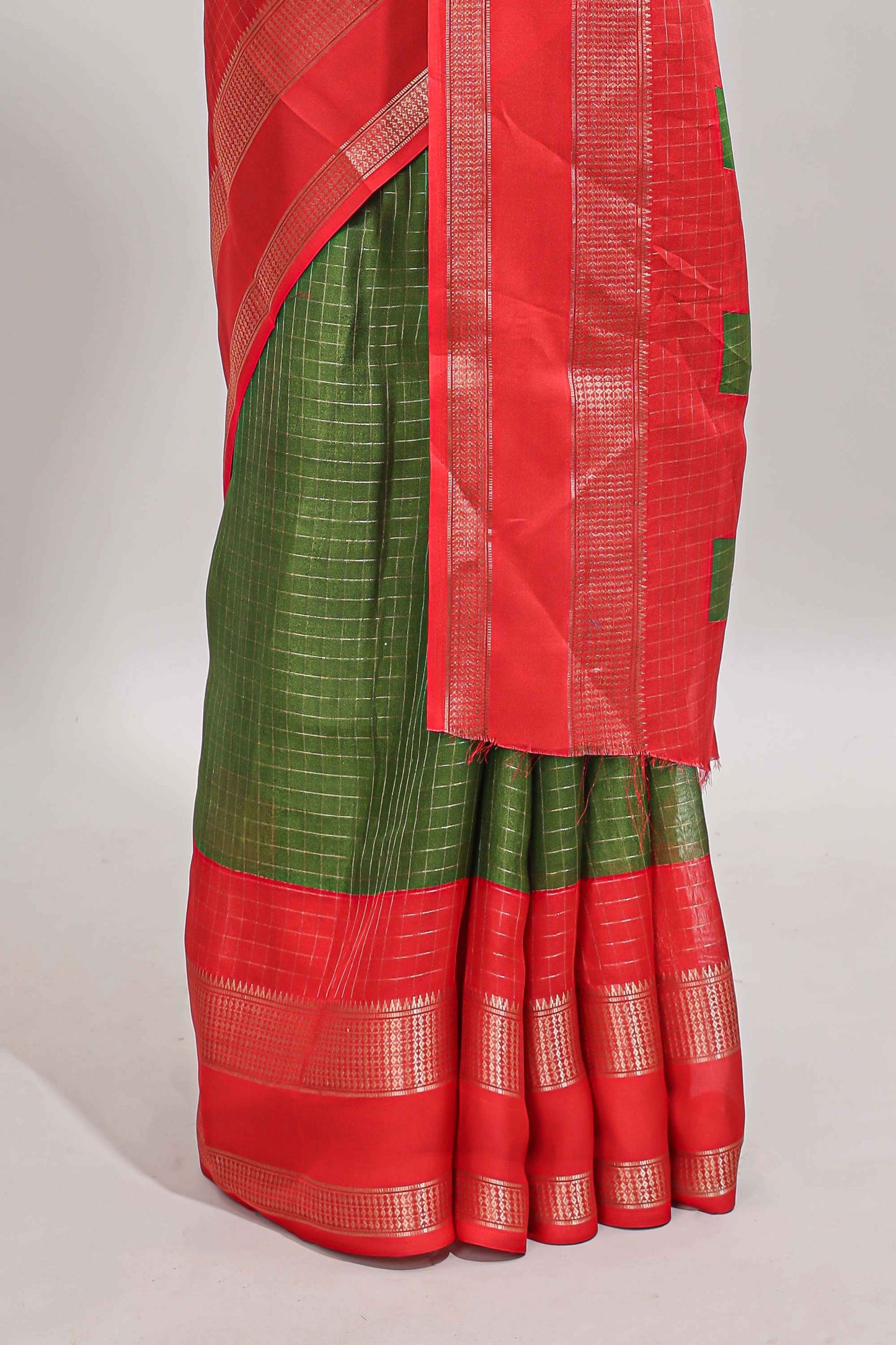 Green checked dola silk saree with contrast zari bentex border and blouse