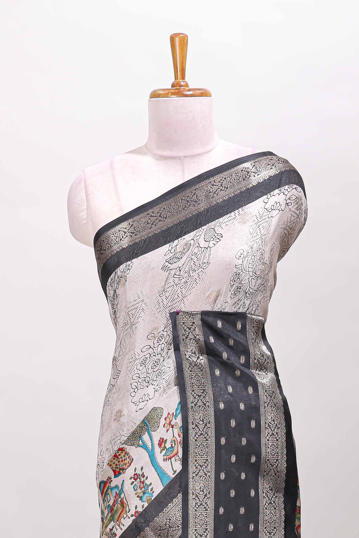 White traditional kalamkari themed marsh georgette saree with contrast black bentex zari border and pallu