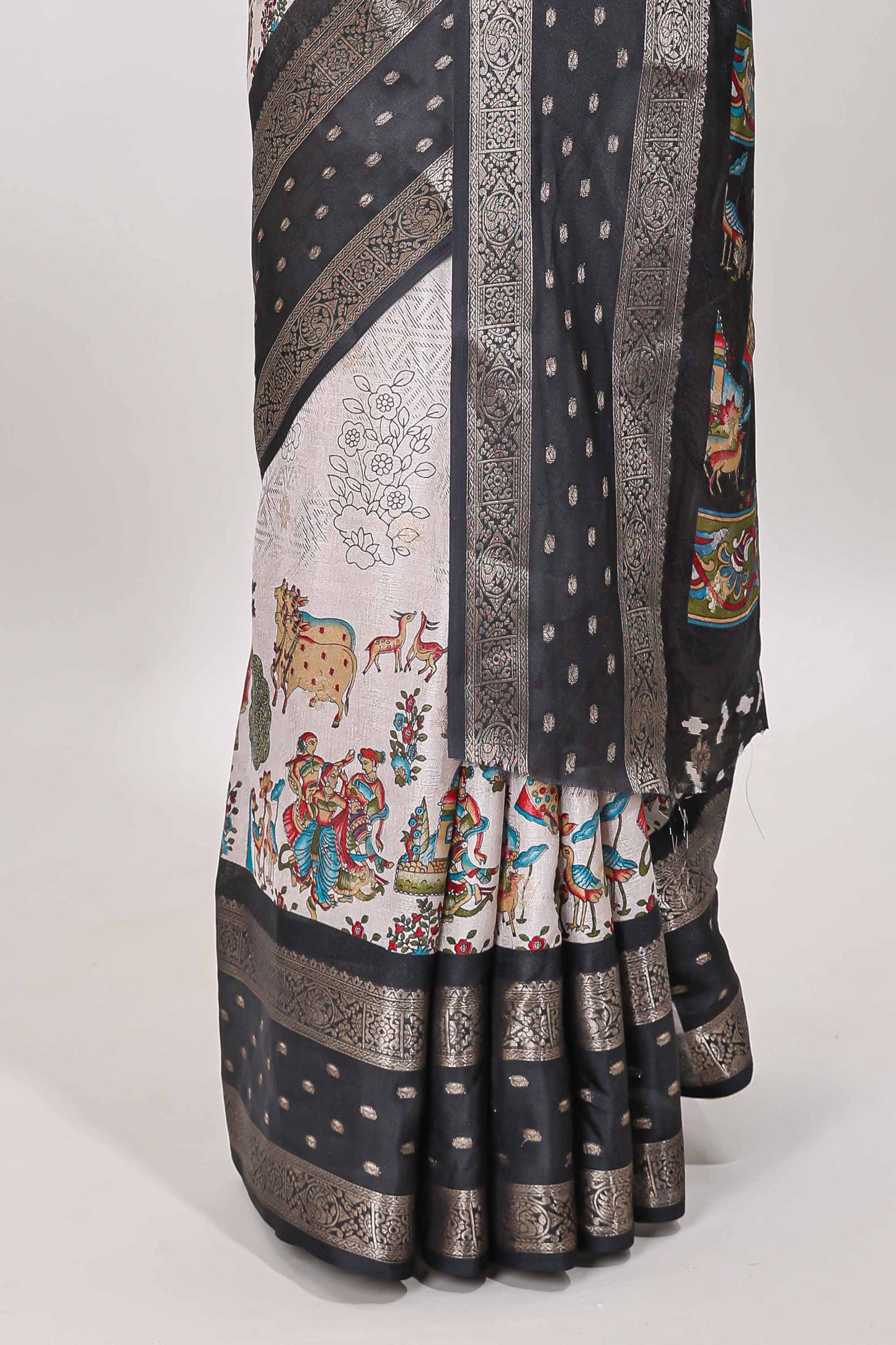 White traditional kalamkari themed marsh georgette saree with contrast black bentex zari border and pallu