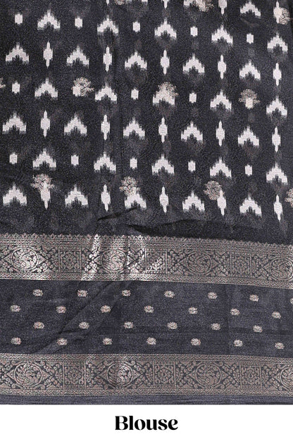 White traditional kalamkari themed marsh georgette saree with contrast black bentex zari border and pallu