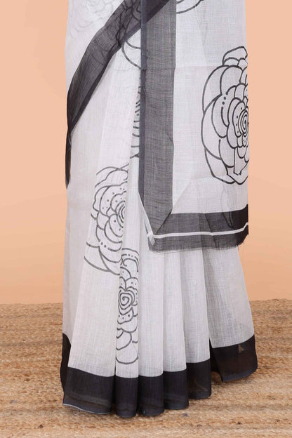 White linen saree with pencil print, contrast border and Blouse