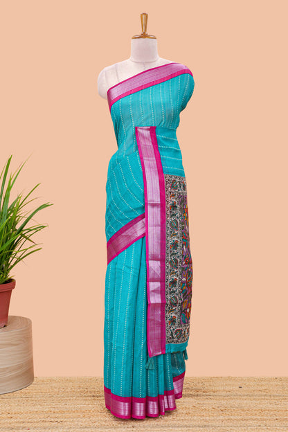 Pecock green linen cotton striped saree with contrast silver zari border and kalamkari pallu
