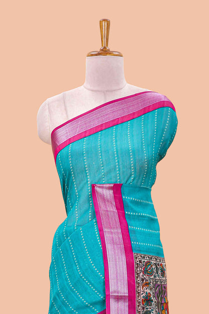 Pecock green linen cotton striped saree with contrast silver zari border and kalamkari pallu