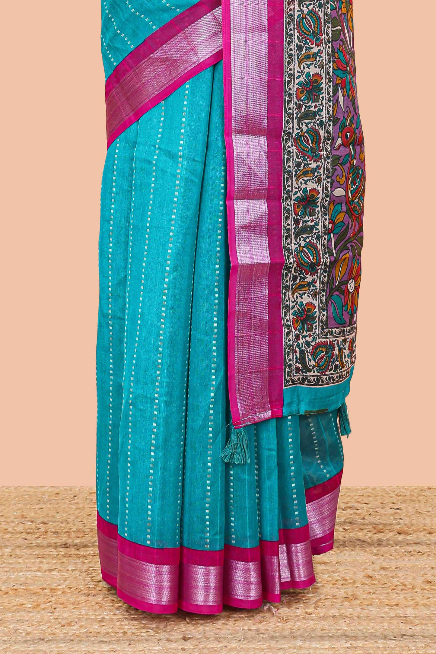 Pecock green linen cotton striped saree with contrast silver zari border and kalamkari pallu
