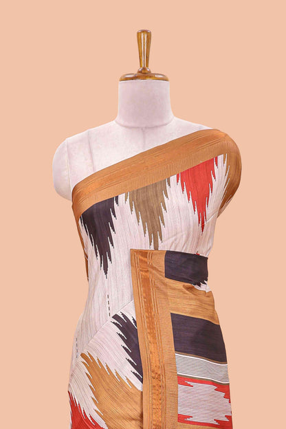 Beige tussar silk saree with chevron ikkat design and geometrical zari border and pallu