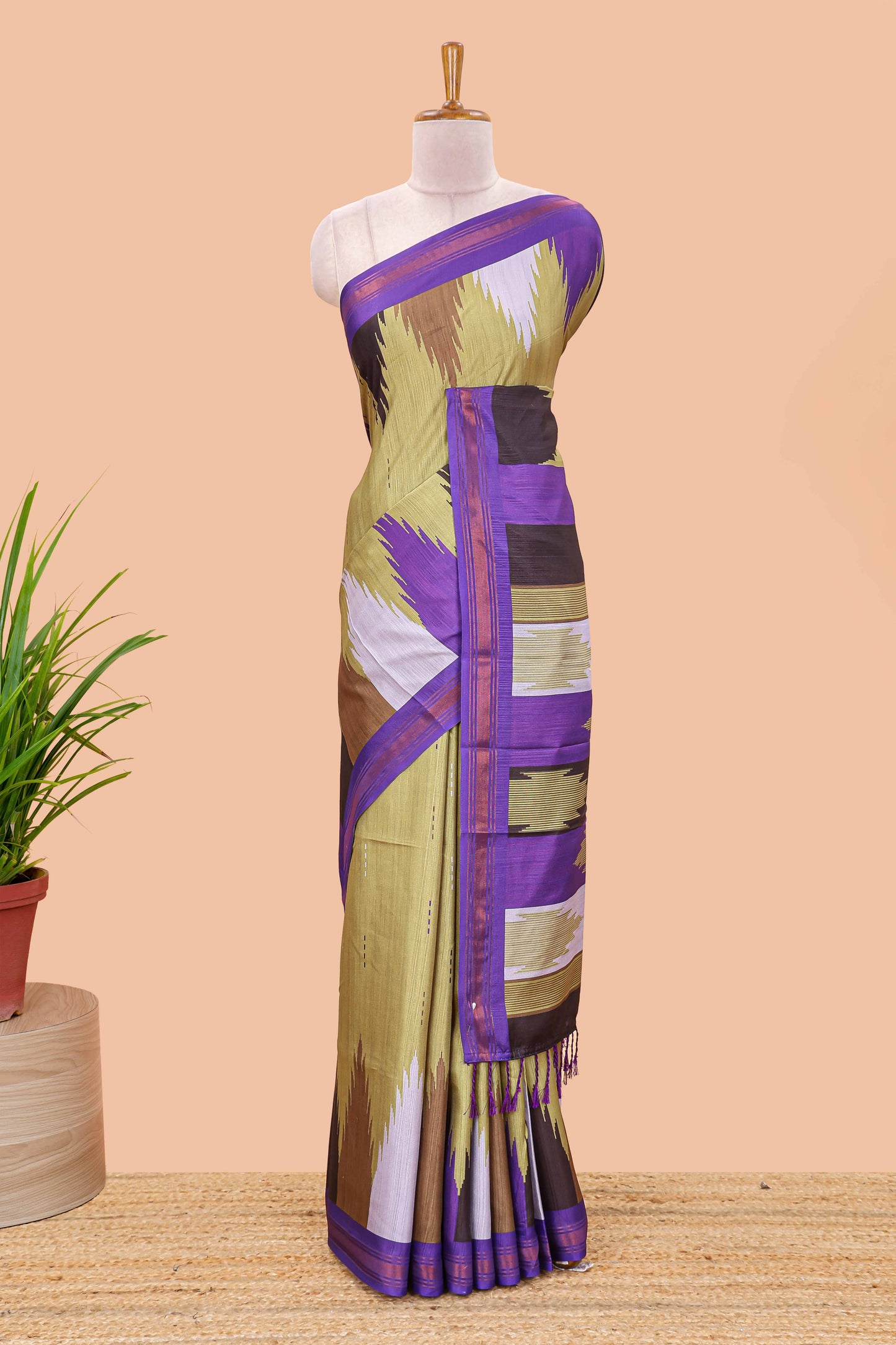 Green tussar silk saree with chevron ikkat design and geometrical zari border and pallu