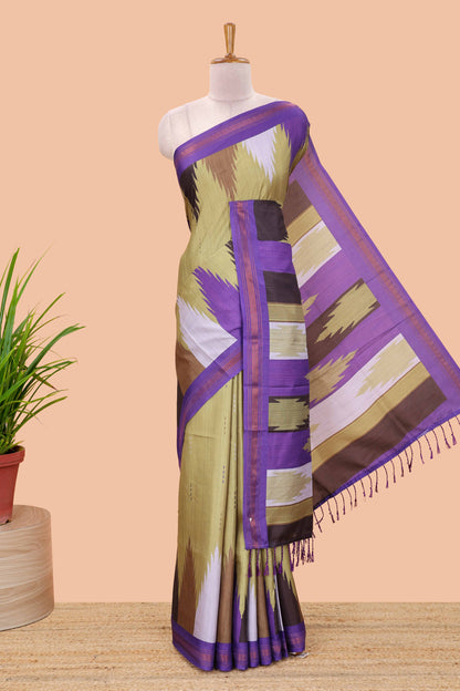 Green tussar silk saree with chevron ikkat design and geometrical zari border and pallu