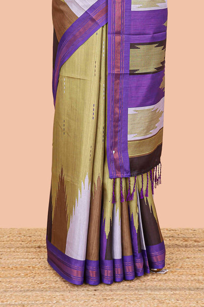 Green tussar silk saree with chevron ikkat design and geometrical zari border and pallu