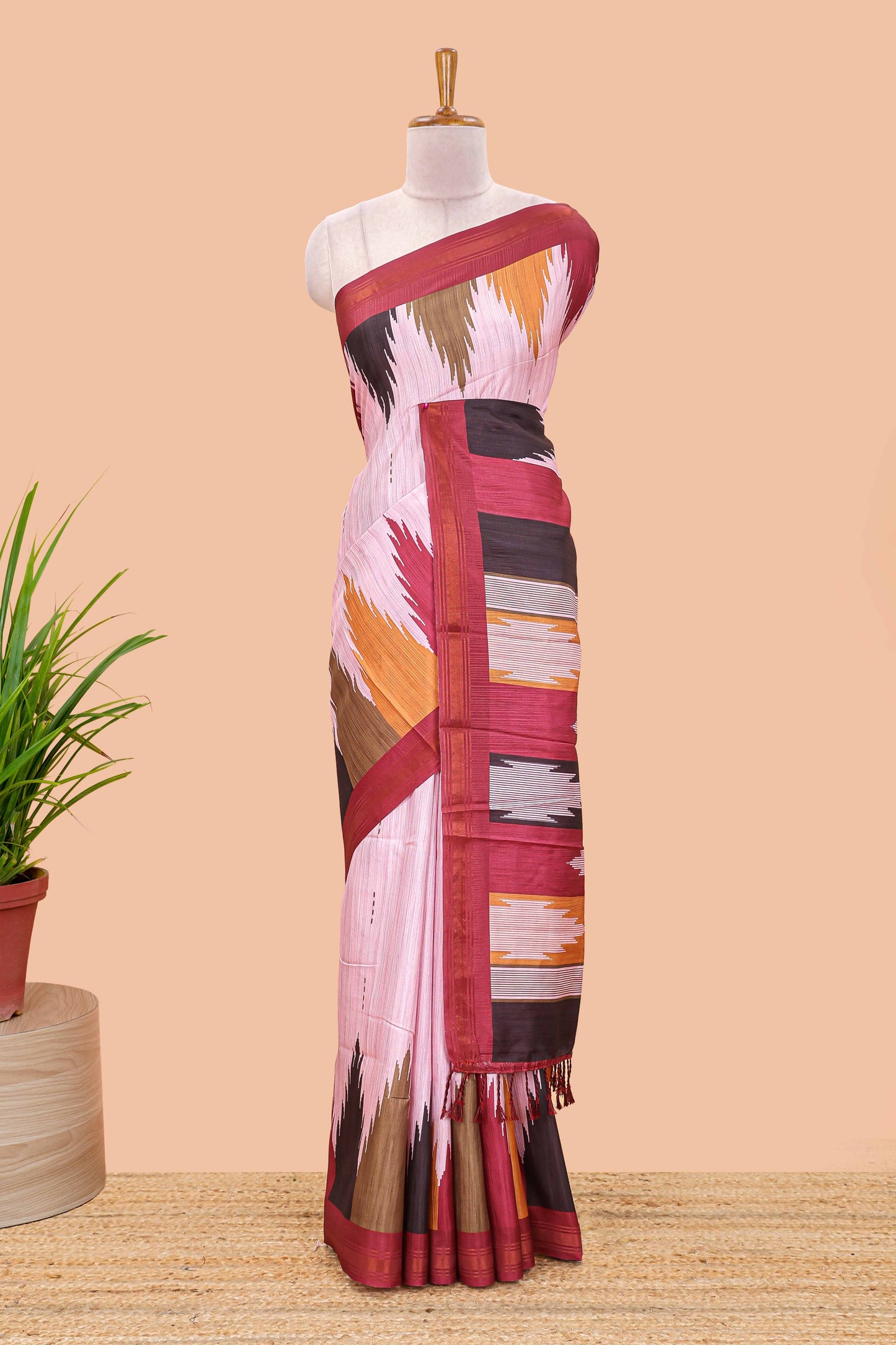 Pink tussar silk saree with chevron ikkat design and geometrical zari border and pallu