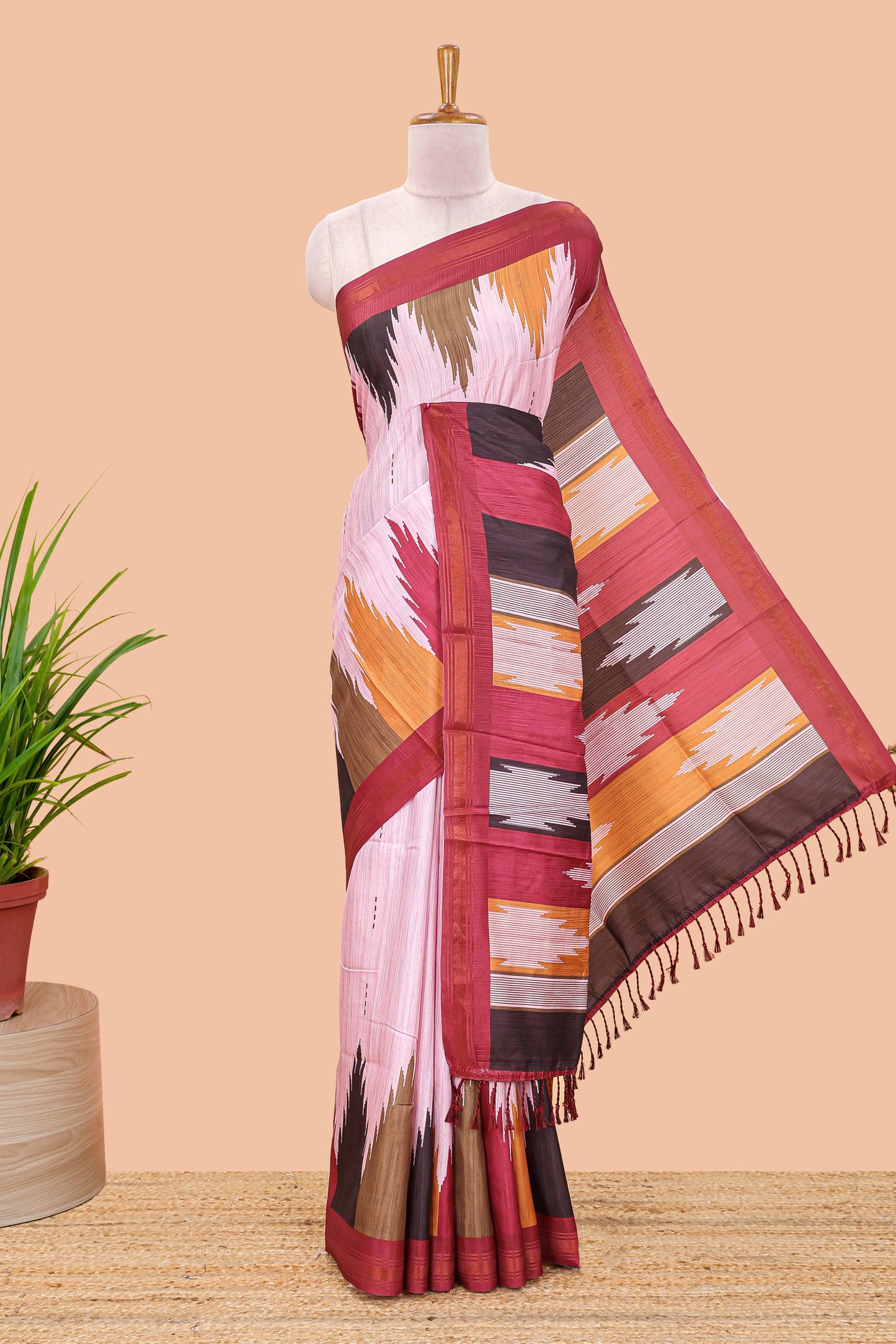 Pink tussar silk saree with chevron ikkat design and geometrical zari border and pallu