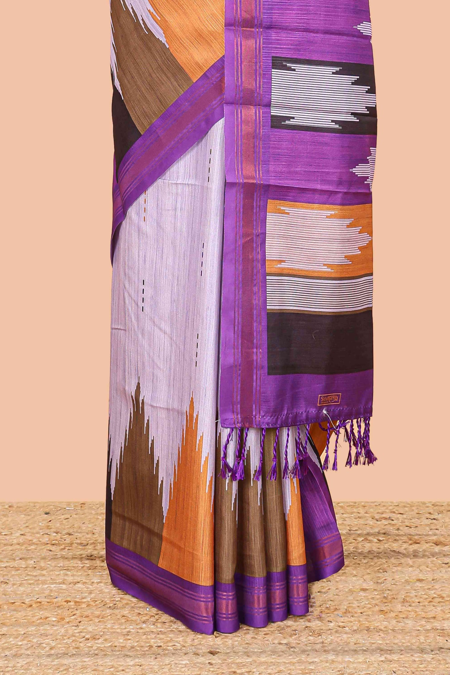 Lavender tussar silk saree with chevron ikkat design and geometrical zari border and pallu