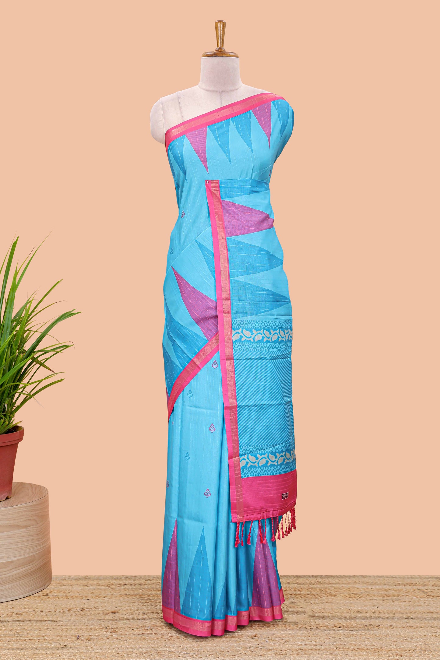 Blue semi tussar silk saree with all over paisley butta, geometric ikkat pattern and zari border