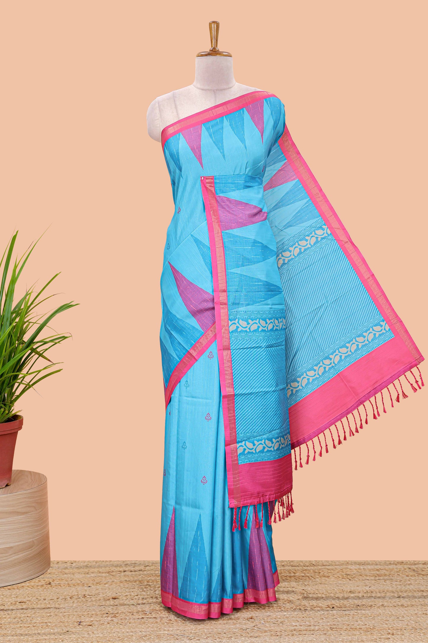 Blue semi tussar silk saree with all over paisley butta, geometric ikkat pattern and zari border