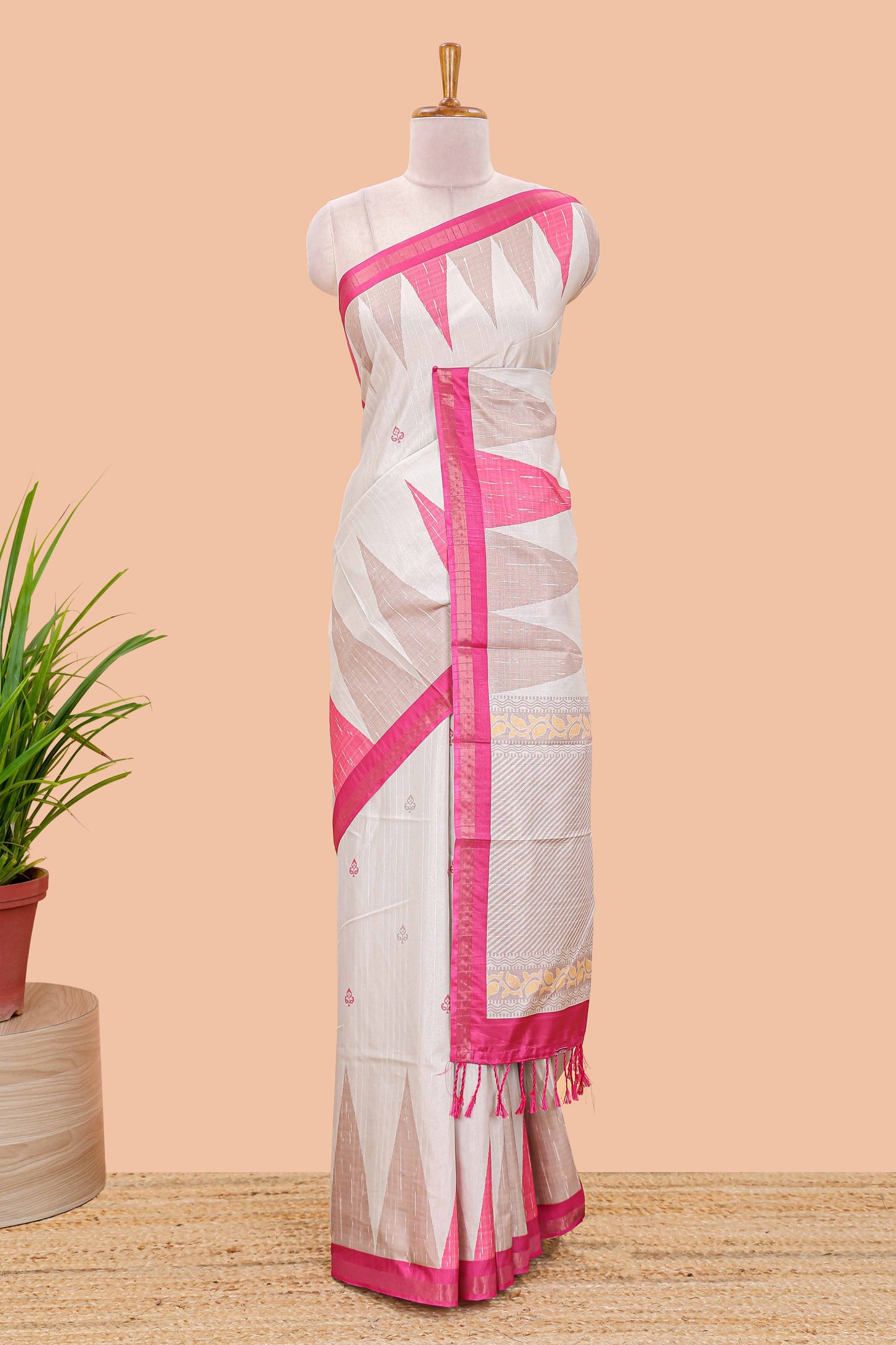 Sandal semi tussar silk saree with all over paisley butta, geometric ikkat pattern and zari border