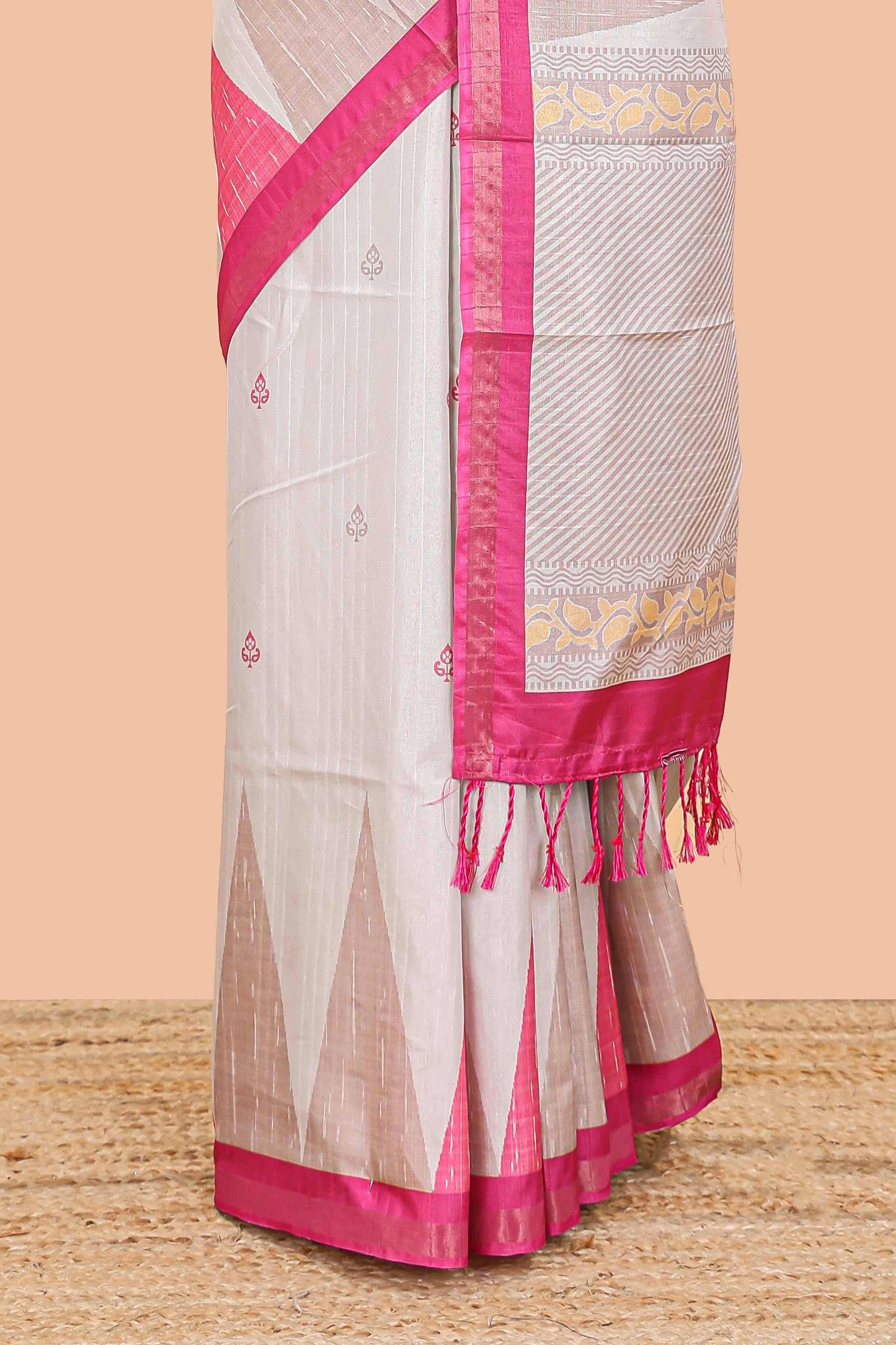 Sandal semi tussar silk saree with all over paisley butta, geometric ikkat pattern and zari border