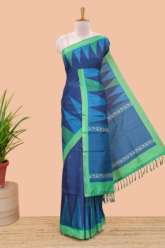 Blue semi tussar silk saree with all over paisley butta, geometric ikkat pattern and zari border