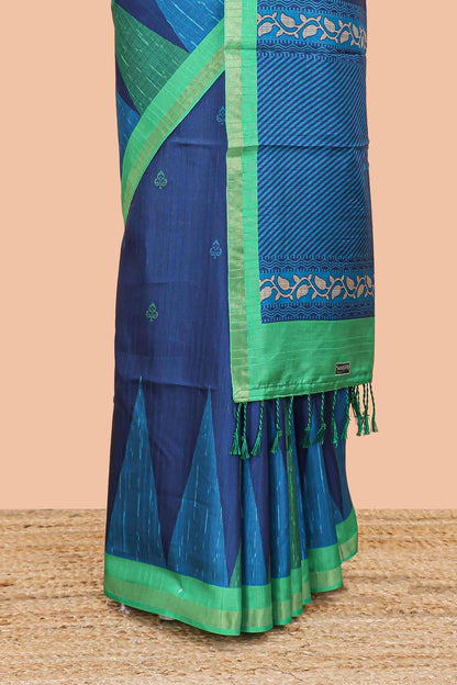 Blue semi tussar silk saree with all over paisley butta, geometric ikkat pattern and zari border