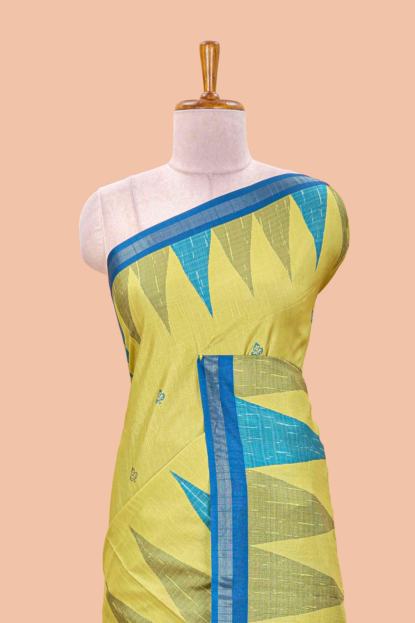 Green semi tussar silk saree with all over paisley butta, geometric ikkat pattern and zari border