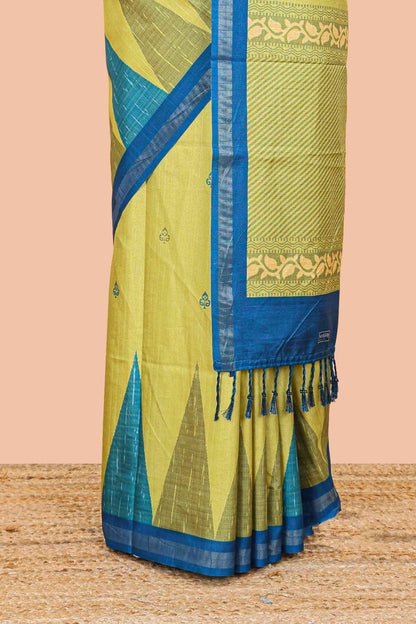 Green semi tussar silk saree with all over paisley butta, geometric ikkat pattern and zari border