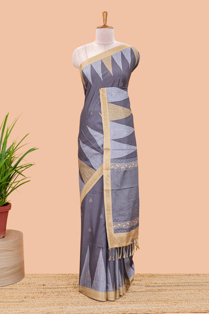 Grey semi tussar silk saree with all over paisley butta, geometric ikkat pattern and zari border