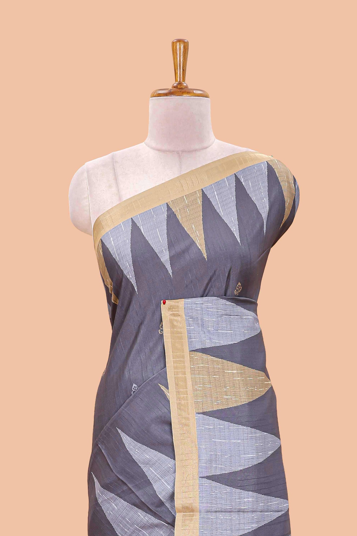 Grey semi tussar silk saree with all over paisley butta, geometric ikkat pattern and zari border