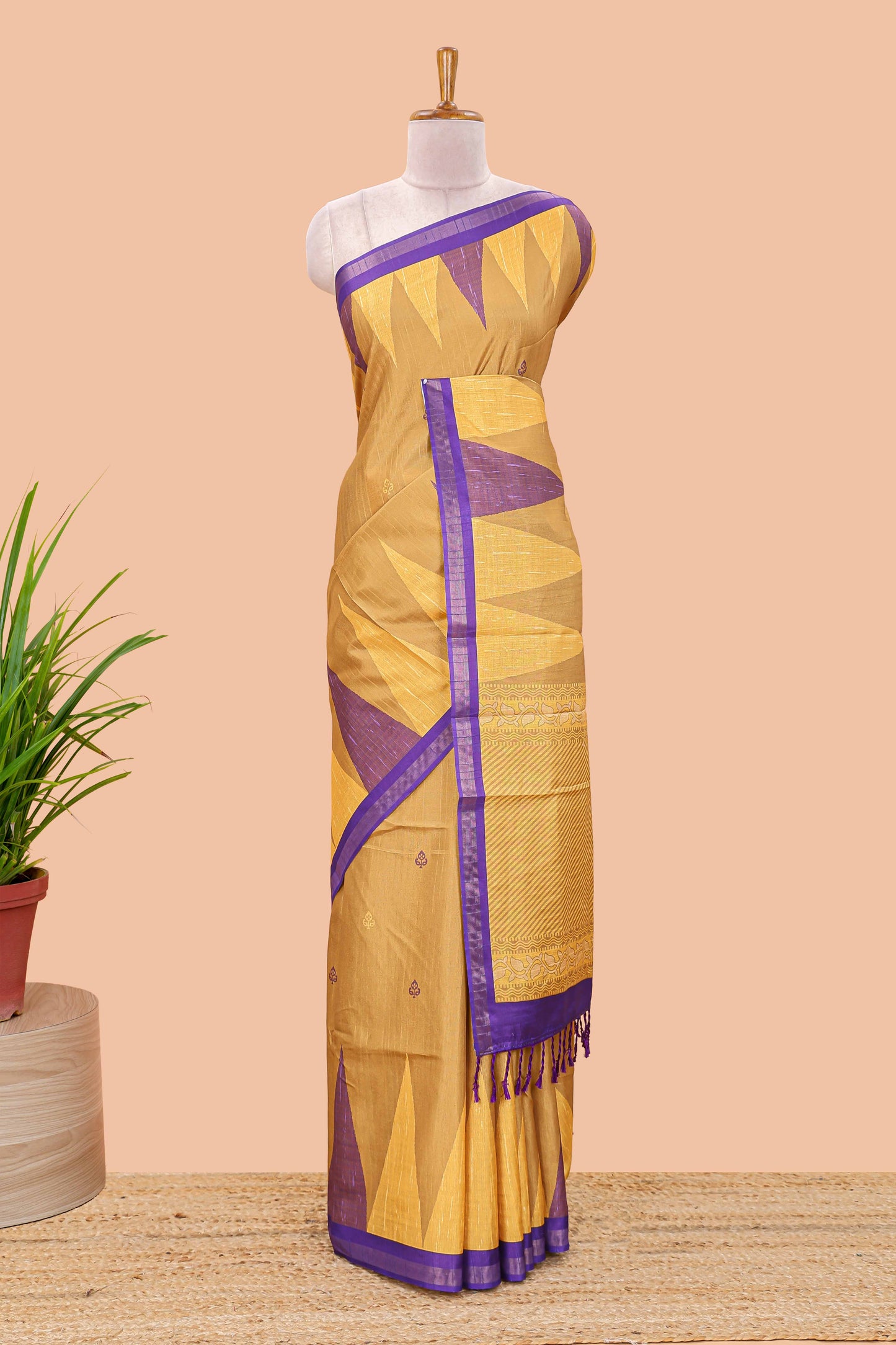 Orange semi tussar silk saree with all over paisley butta, geometric ikkat pattern and zari border