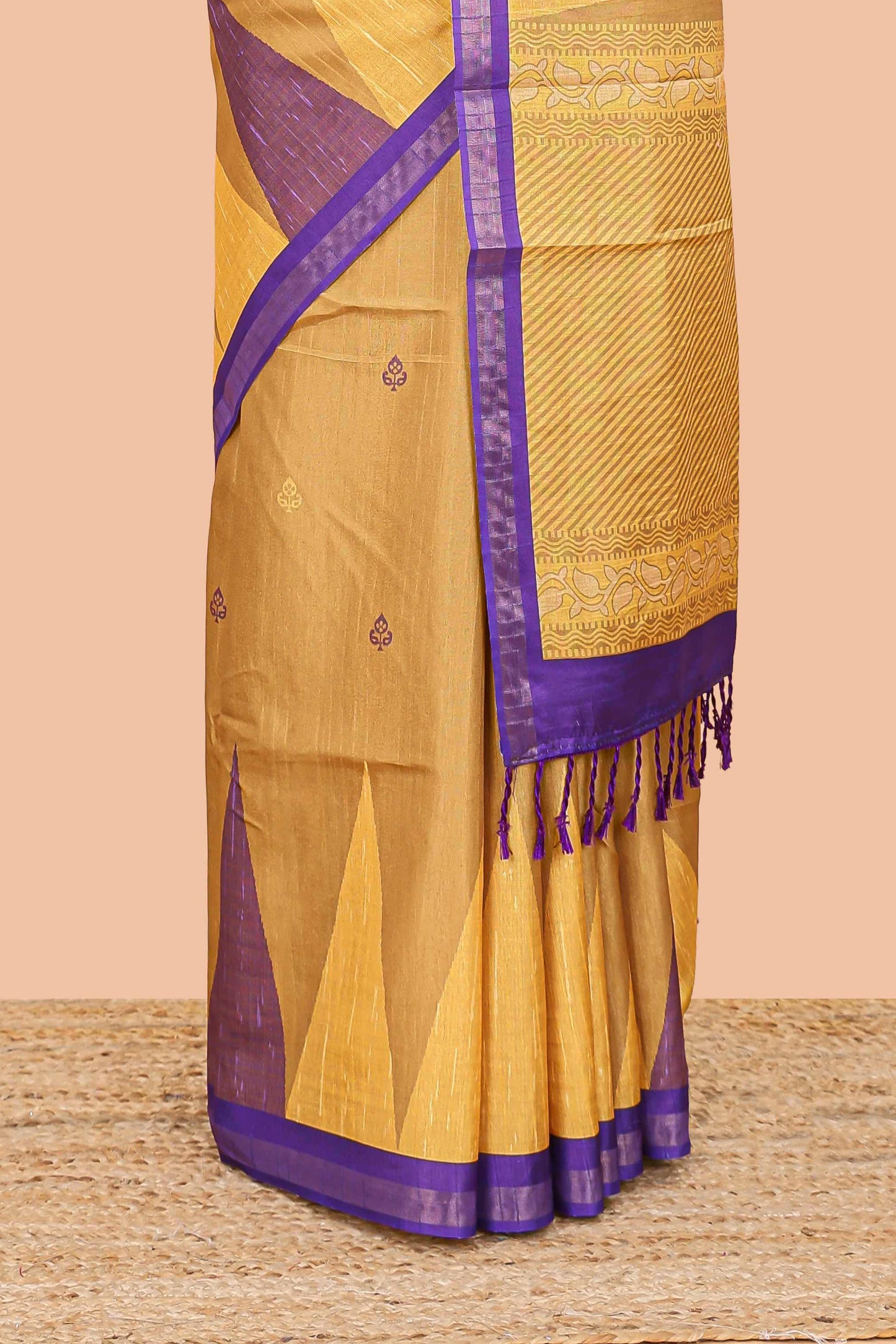 Orange semi tussar silk saree with all over paisley butta, geometric ikkat pattern and zari border