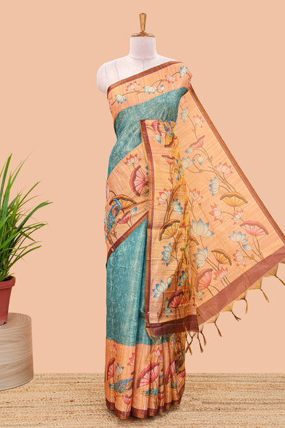 Peacock green tissue tussar saree with lotus jaal pallu and scattered lotus motif blouse