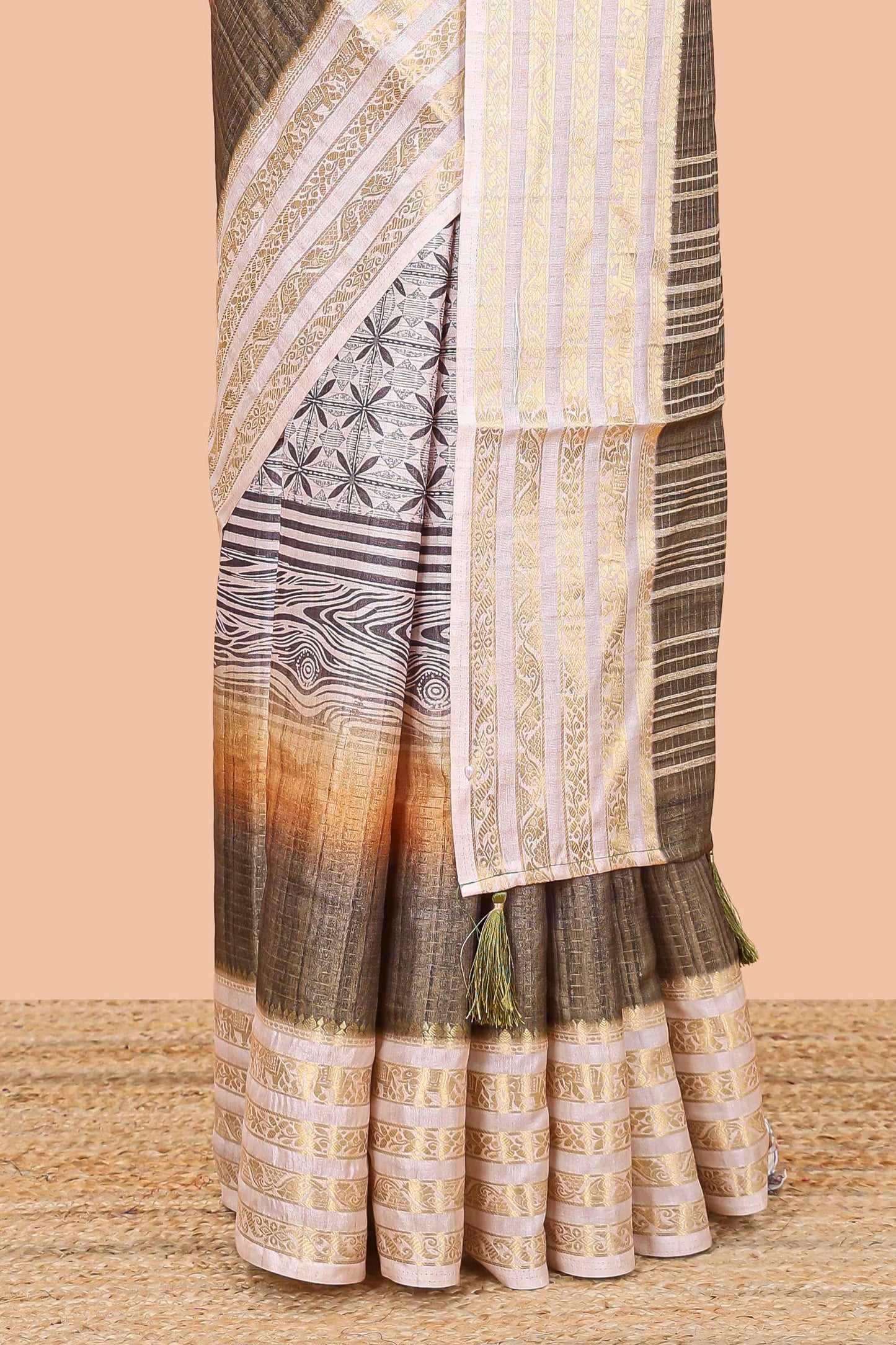 Olive green dola silk saree featuring geometric block print and contrast zari border