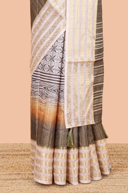 Olive green dola silk saree featuring geometric block print and contrast zari border