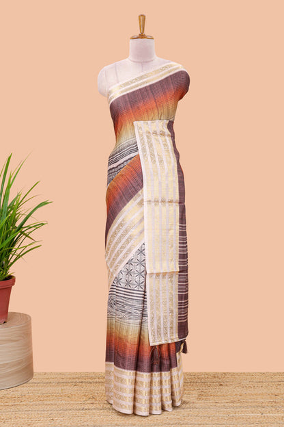 Brown dola silk saree featuring geometric block print and contrast zari border