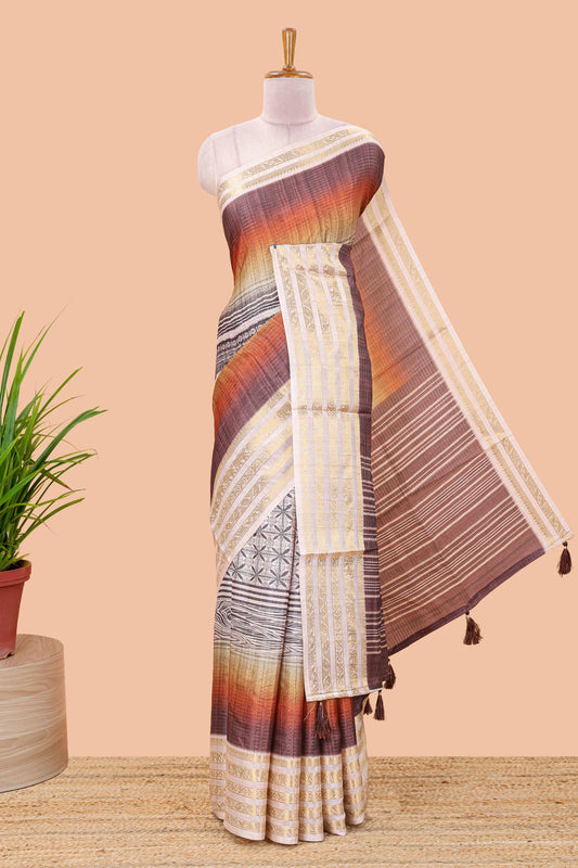 Brown dola silk saree featuring geometric block print and contrast zari border