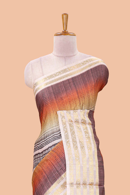 Brown dola silk saree featuring geometric block print and contrast zari border