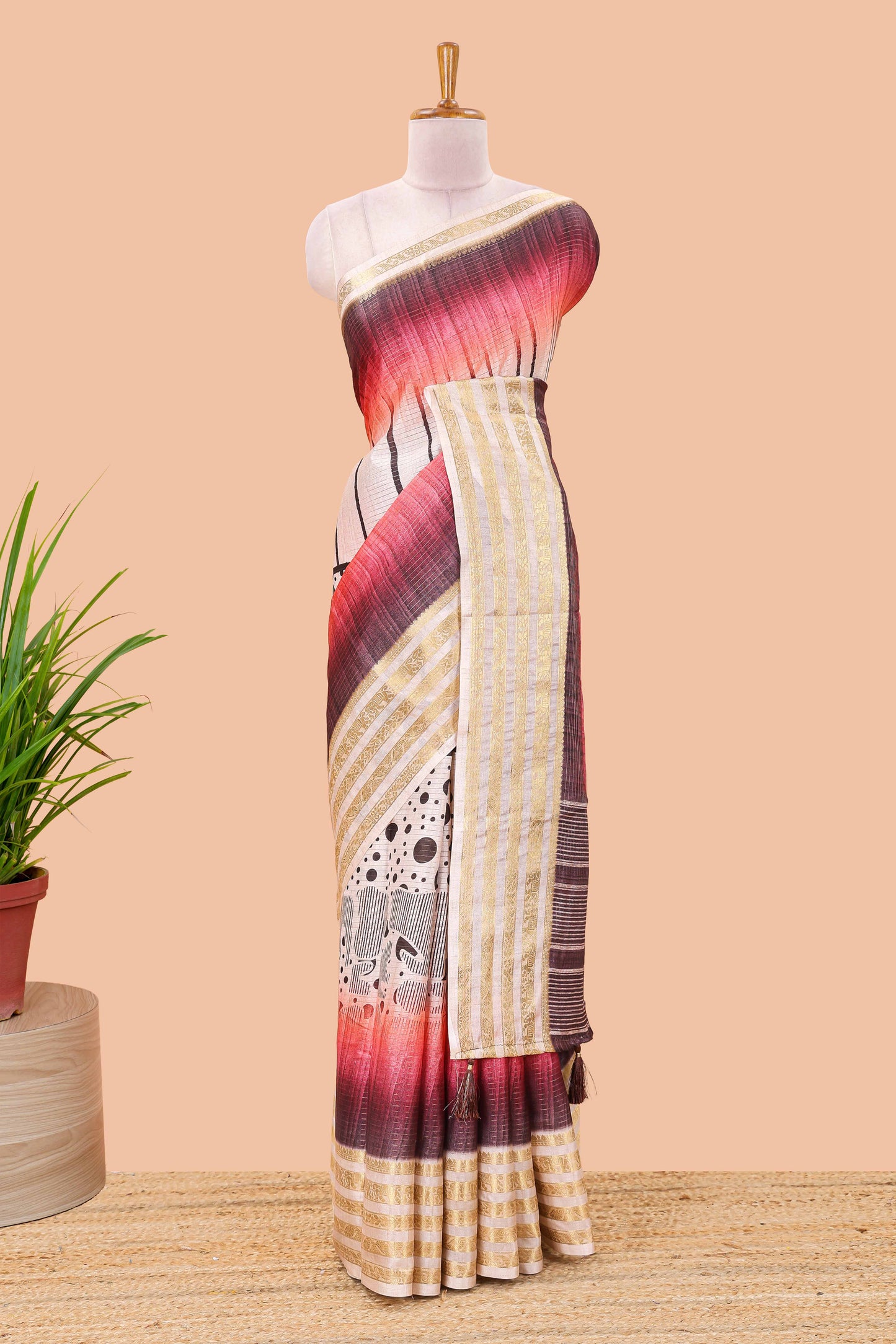 Maroon dola silk saree featuring dot striped design and contrast zari border
