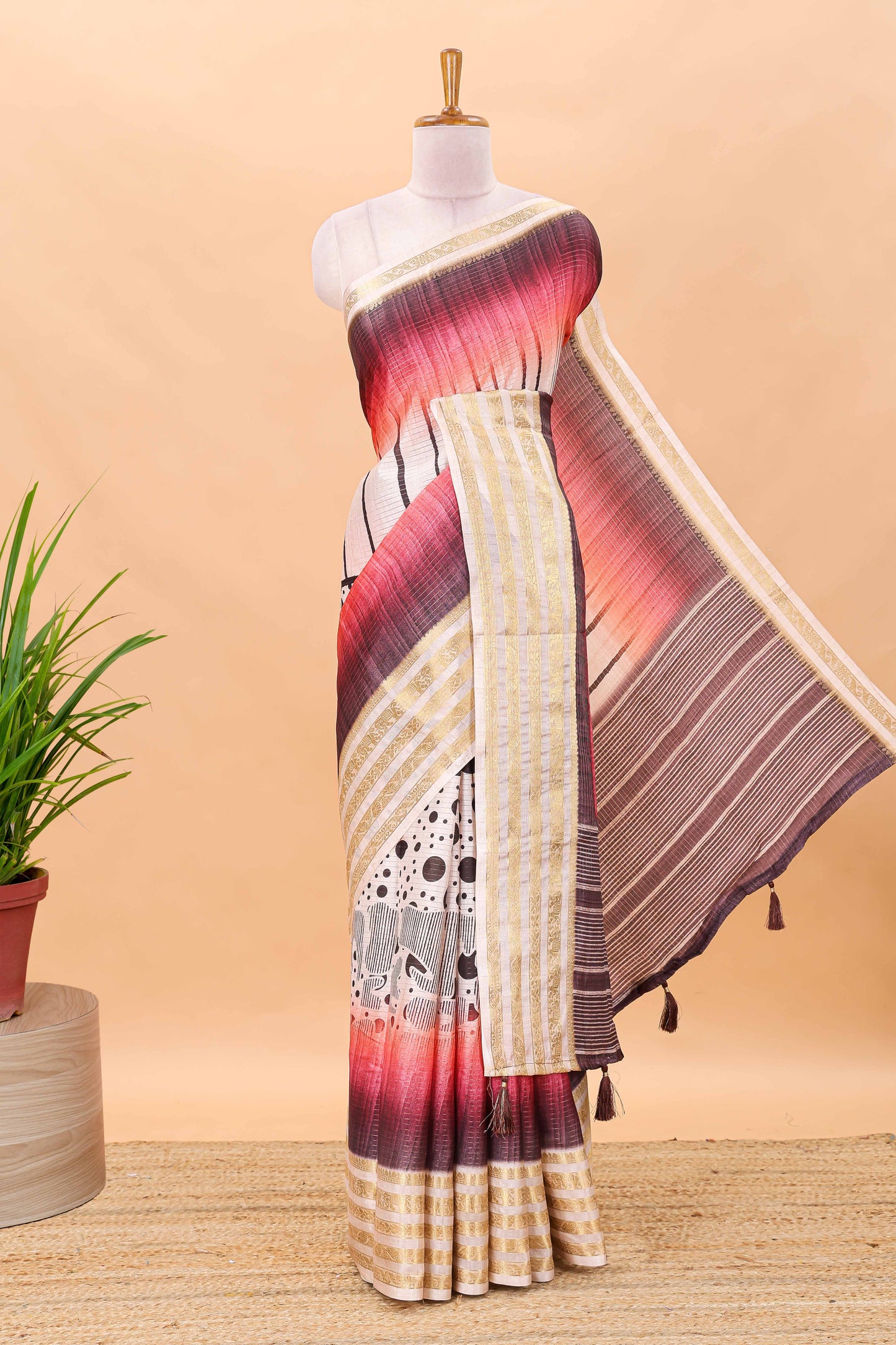 Maroon dola silk saree featuring dot striped design and contrast zari border