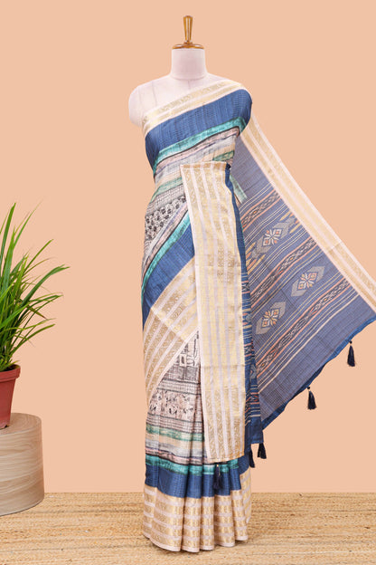 Blue dola silk saree featuring monochrome fusion print and contrast zari border