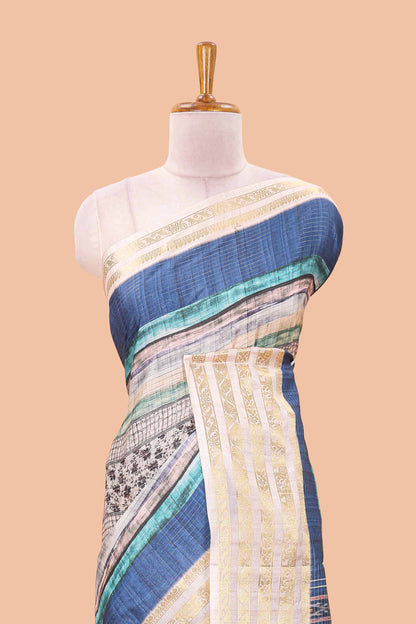 Blue dola silk saree featuring monochrome fusion print and contrast zari border