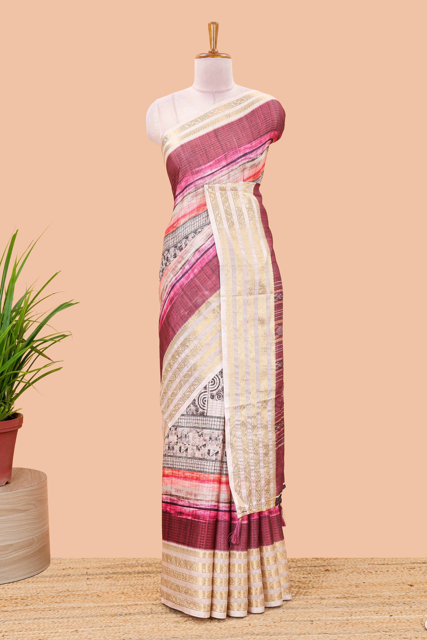 Maroon dola silk saree featuring monochrome fusion print and contrast zari border