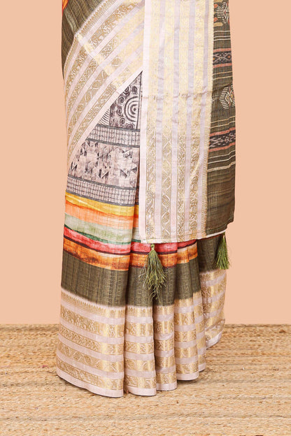 Green dola silk saree featuring monochrome fusion print and contrast zari border