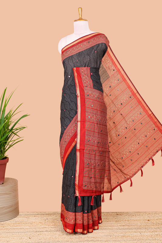 Black chanderi cotton saree with all over peacock feather print, mirror work, contrast border and pallu
