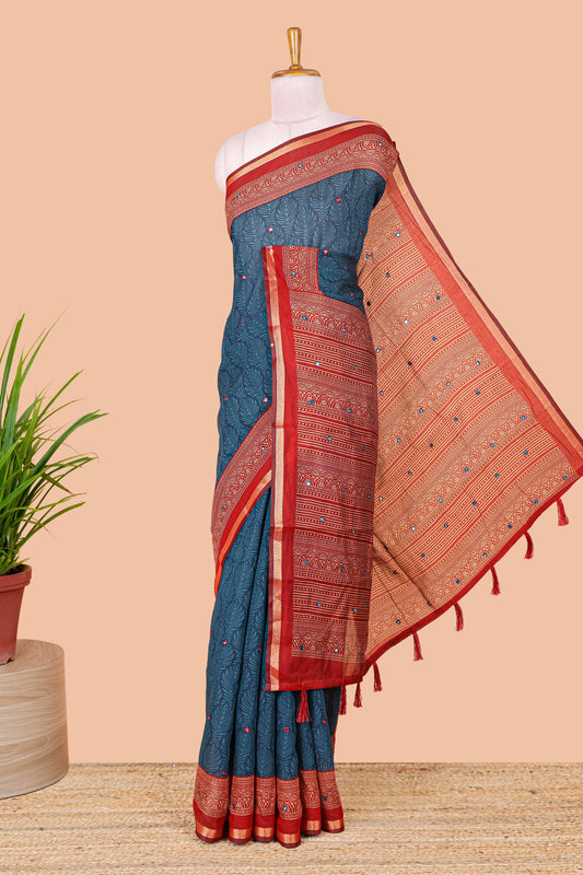 Blue chanderi cotton saree with all over peacock feather print, mirror work, contrast border and pallu