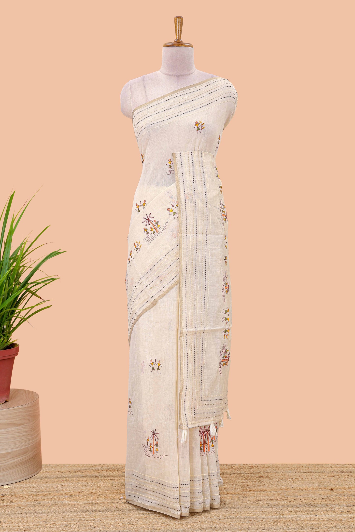 Cream chanderi cotton saree with warli art embroidered body and vertical stitched pallu