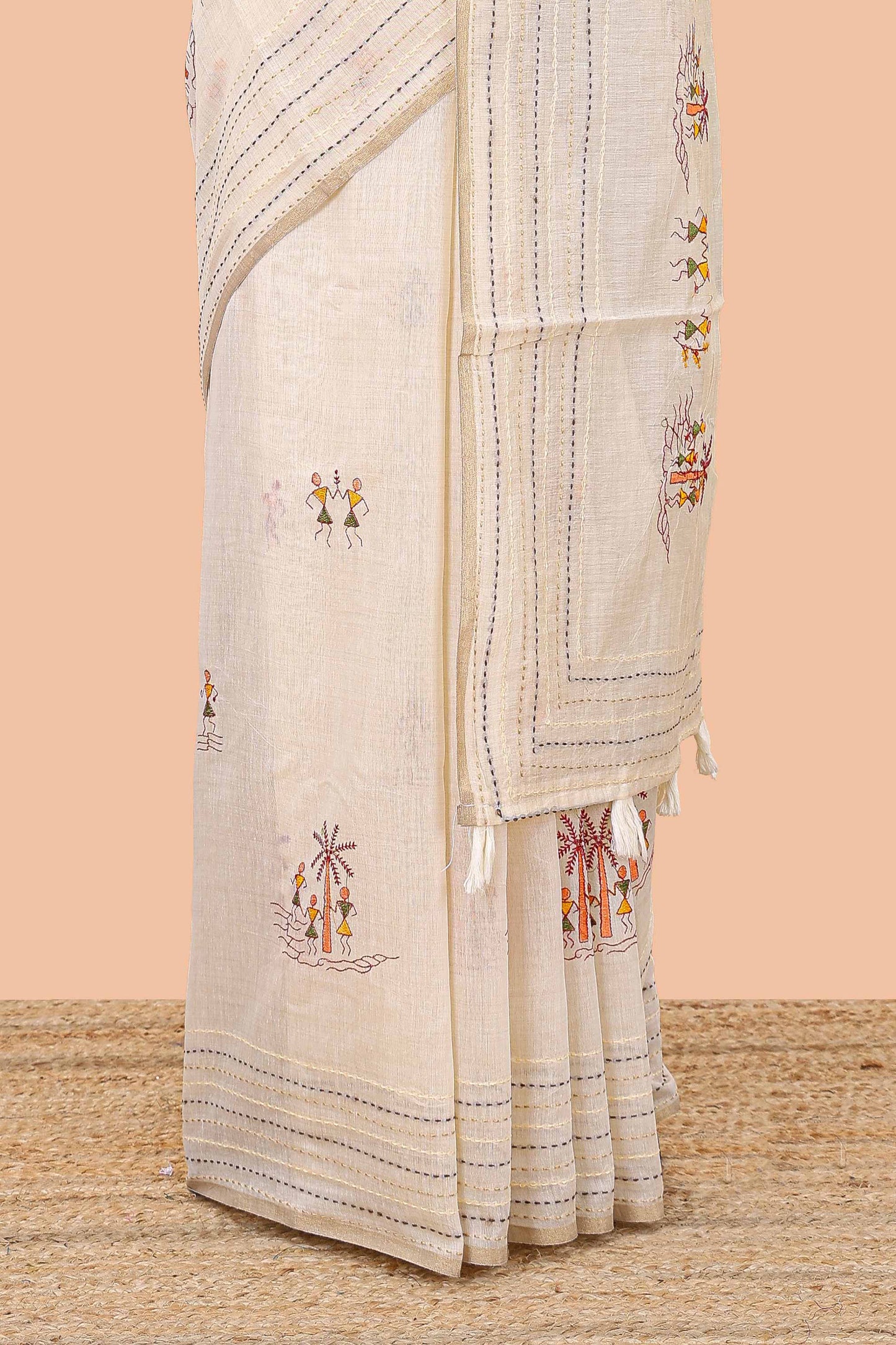 Cream chanderi cotton saree with warli art embroidered body and vertical stitched pallu